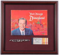 1962 Disneyland Custom Framed Vintage On-Site Park Guide with Vintage A-E Ticket Book & Charm Bracelet at PristineAuction.com