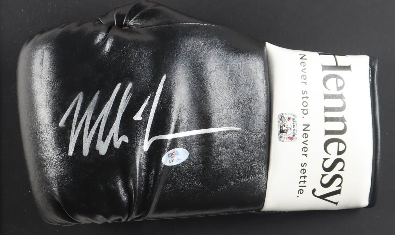 Mike Tyson Signed Custom Framed Hennessy Boxing Glove Display with Tyson vs. Holmes Plaza Poster (PSA & Tyson) at PristineAuction.com Mike Tyson Signed Custom Framed Hennessy Boxing Glove Display with Tyson vs. Holmes Plaza Poster (PSA & Tyson) at PristineAuction.com