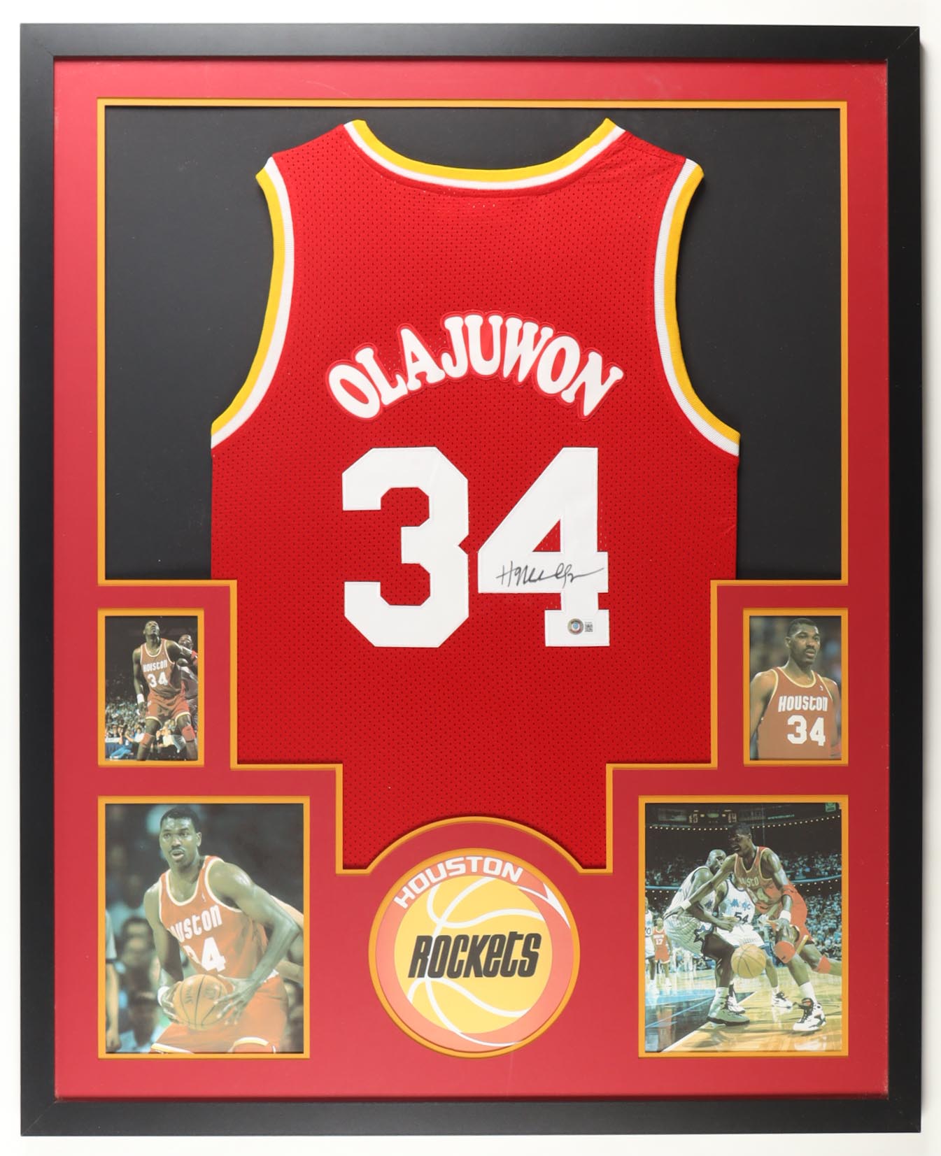 Hakeem Olajuwon Signed Custom Framed Jersey Display with Photos (Beckett) at PristineAuction.com Hakeem Olajuwon Signed Custom Framed Jersey Display with Photos (Beckett) at PristineAuction.com