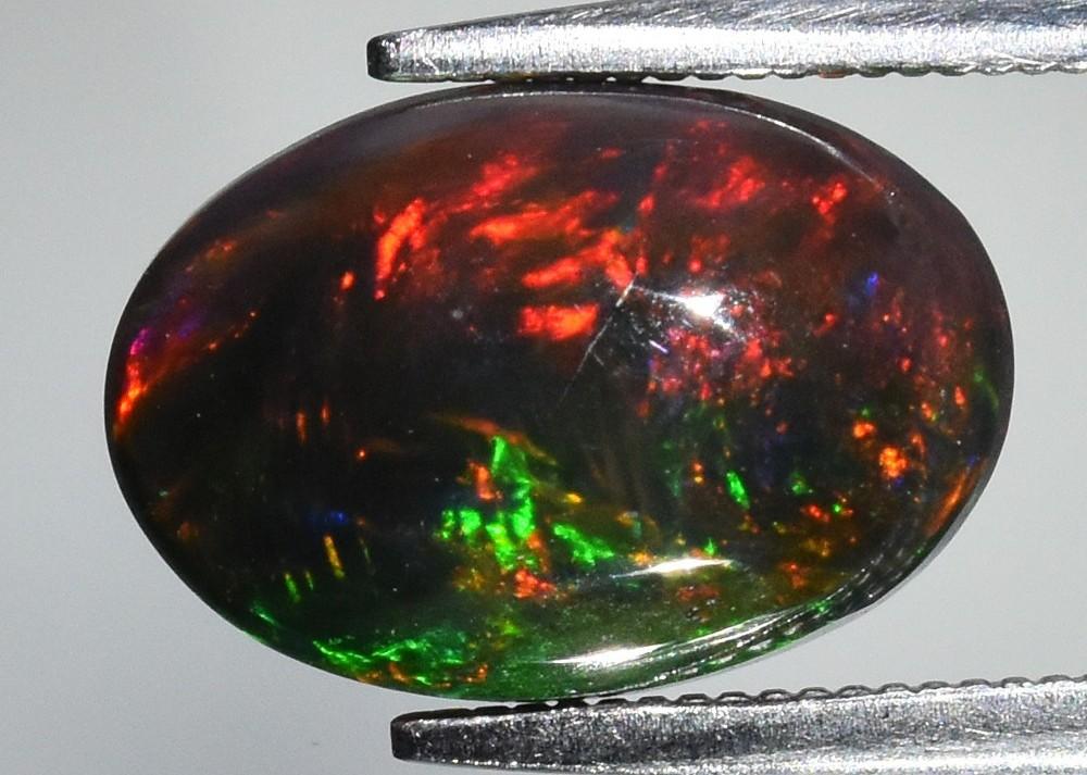 2.38 Carats Natural Black Opal Loose | $2,200 Estimated Retail Value (UGL Cert) at PristineAuction.com 2.38 Carats Natural Black Opal Loose | $2,200 Estimated Retail Value (UGL Cert) at PristineAuction.com