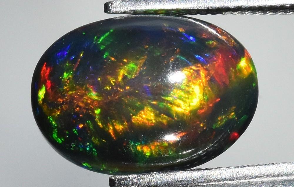2.23 Carats Natural Black Opal Loose | $2,100 Estimated Retail Value (UGL Cert) at PristineAuction.com 2.23 Carats Natural Black Opal Loose | $2,100 Estimated Retail Value (UGL Cert) at PristineAuction.com