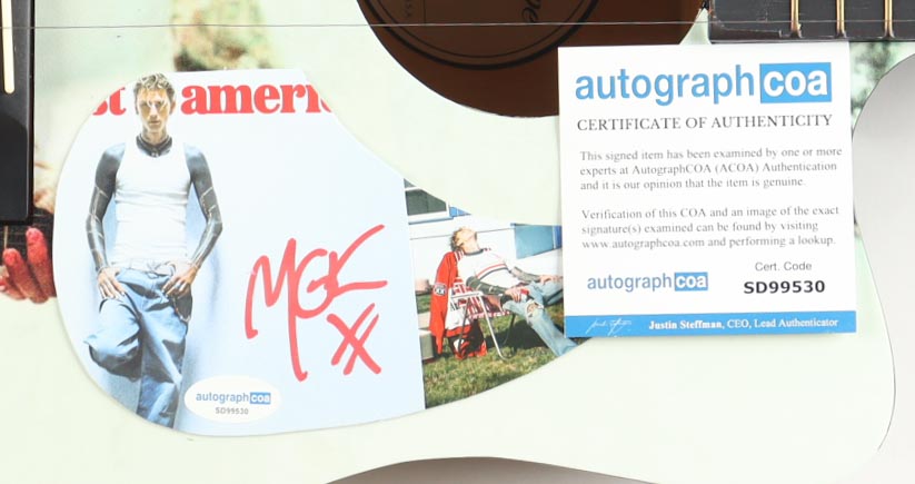 MGK Guitar with Signed Custom Insert Pickguard (ACOA) at PristineAuction.com MGK Guitar with Signed Custom Insert Pickguard (ACOA) at PristineAuction.com