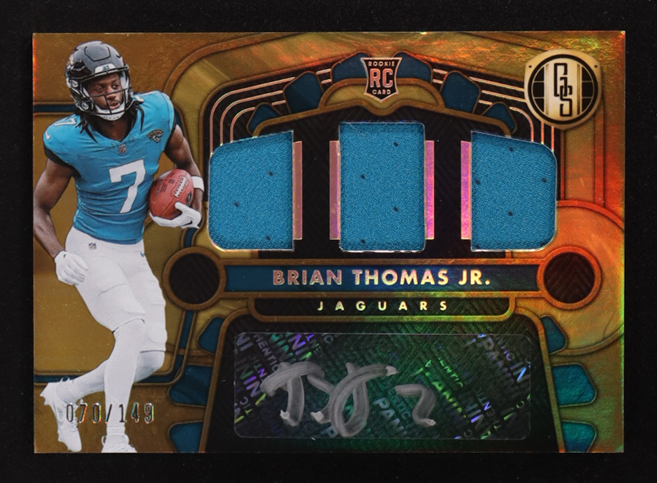 Brian Thomas Jr. 2024 Panini Gold Standard Rookie Jersey Autographs Triple #3 RC #70/149 at PristineAuction.com Brian Thomas Jr. 2024 Panini Gold Standard Rookie Jersey Autographs Triple #3 RC #70/149 at PristineAuction.com