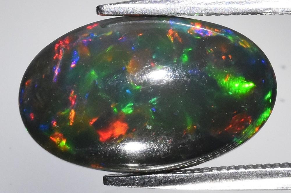 3.07 Carats Natural Black Opal Loose | $2,500 Estimated Retail Value (UGL Cert) at PristineAuction.com 3.07 Carats Natural Black Opal Loose | $2,500 Estimated Retail Value (UGL Cert) at PristineAuction.com