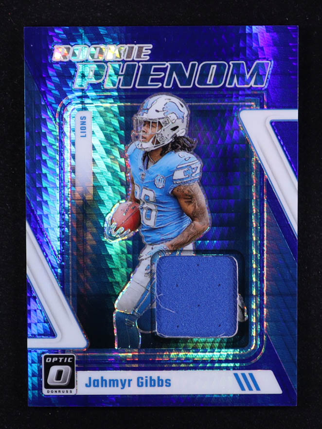 Jahmyr Gibbs 2023 Donruss Optic Rookie Phenoms Jerseys Blue Hyper #14 RC at PristineAuction.com Jahmyr Gibbs 2023 Donruss Optic Rookie Phenoms Jerseys Blue Hyper #14 RC at PristineAuction.com