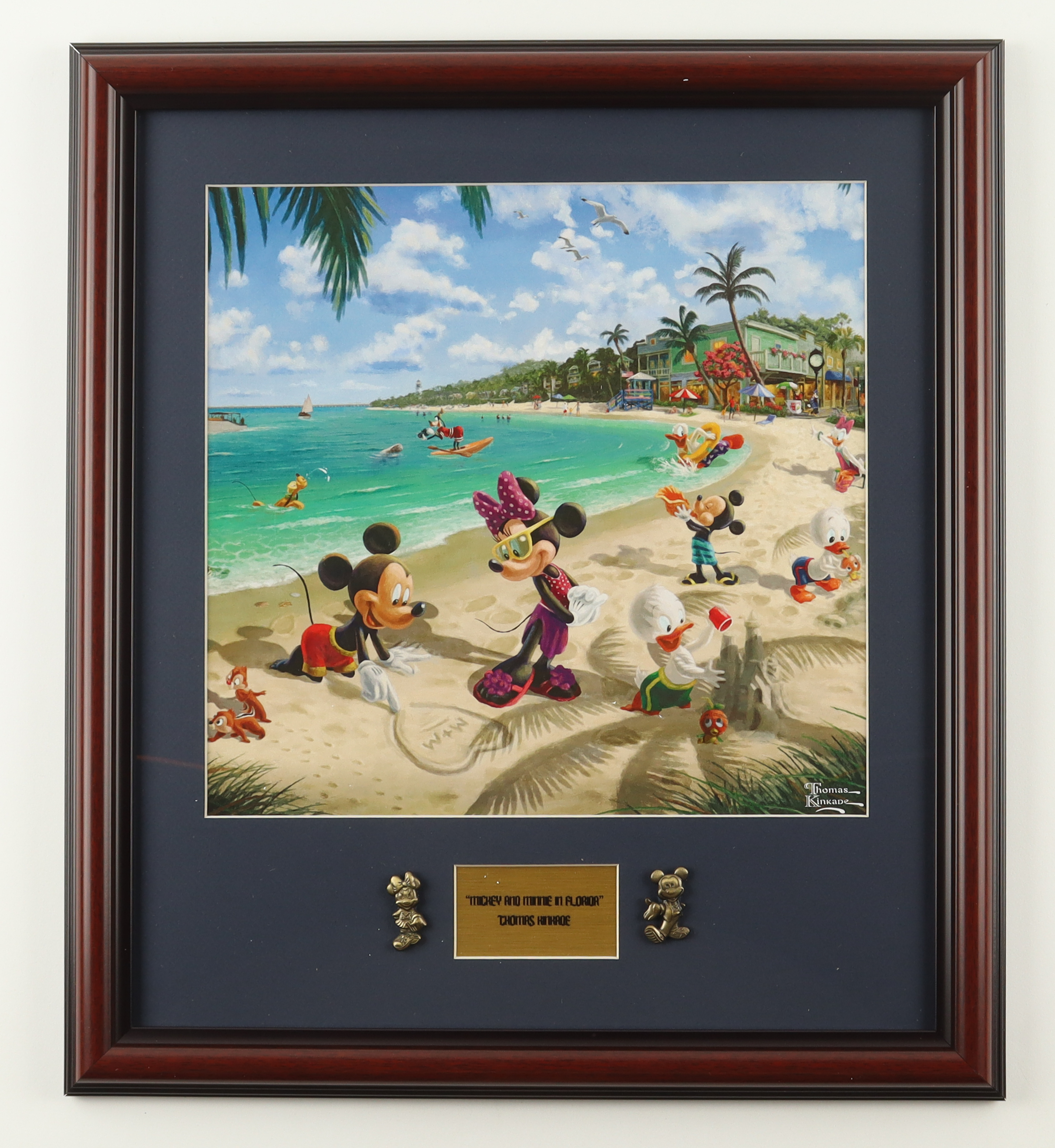Thomas Kinkade "Mickey & Minnie Mouse on the Florida Beach" Custom Framed Print Display with Mickey & Minnie Mouse Brass Pins at PristineAuction.com Thomas Kinkade "Mickey & Minnie Mouse on the Florida Beach" Custom Framed Print Display with Mickey & Minnie Mouse Brass Pins at PristineAuction.com