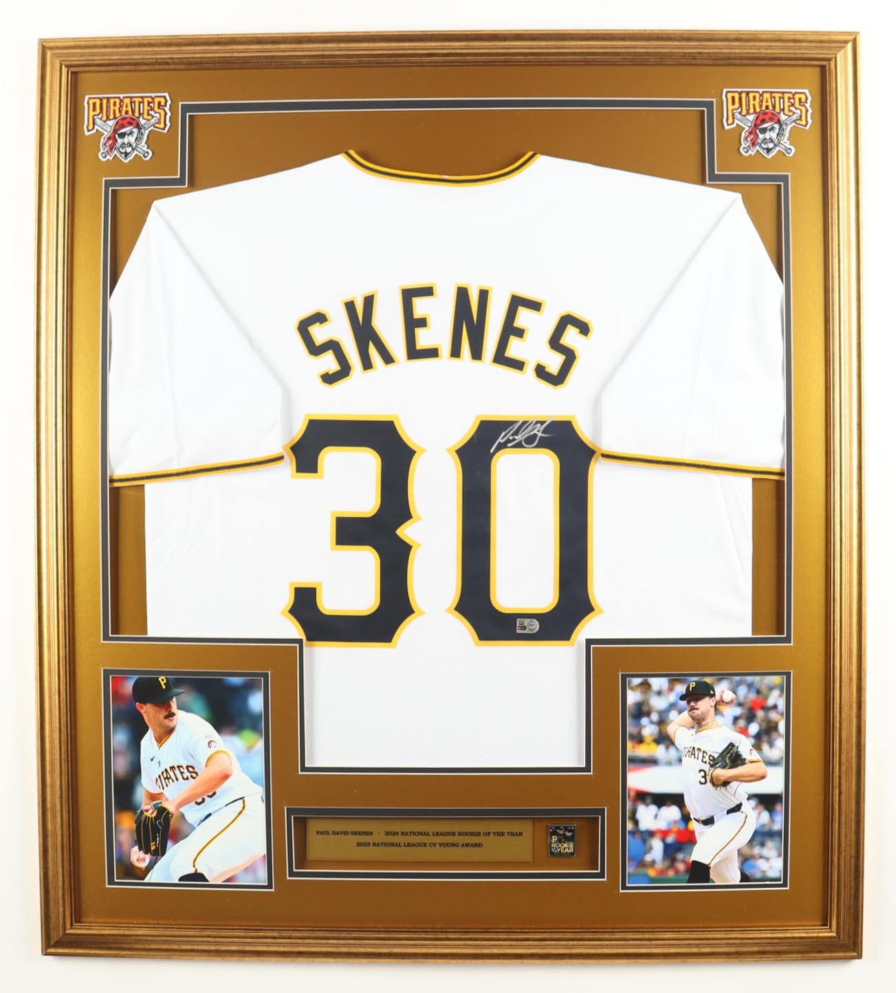 Paul Skenes Signed Custom Framed Jersey Display with 2025 Rookie of the Year Pin & Stat Plaque (MLB) at PristineAuction.com Paul Skenes Signed Custom Framed Jersey Display with 2025 Rookie of the Year Pin & Stat Plaque (MLB) at PristineAuction.com