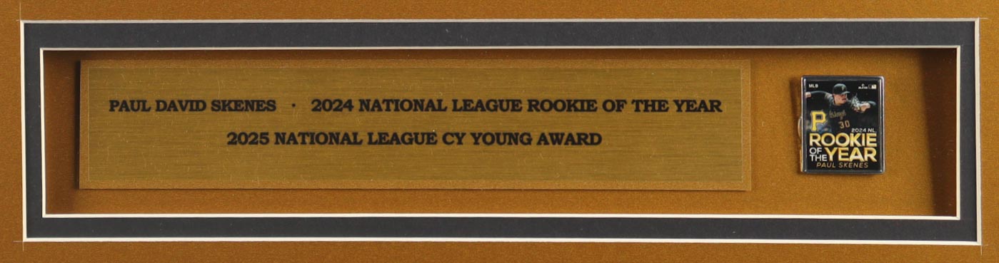 Paul Skenes Signed Custom Framed Jersey Display with 2025 Rookie of the Year Pin & Stat Plaque (MLB) at PristineAuction.com Paul Skenes Signed Custom Framed Jersey Display with 2025 Rookie of the Year Pin & Stat Plaque (MLB) at PristineAuction.com
