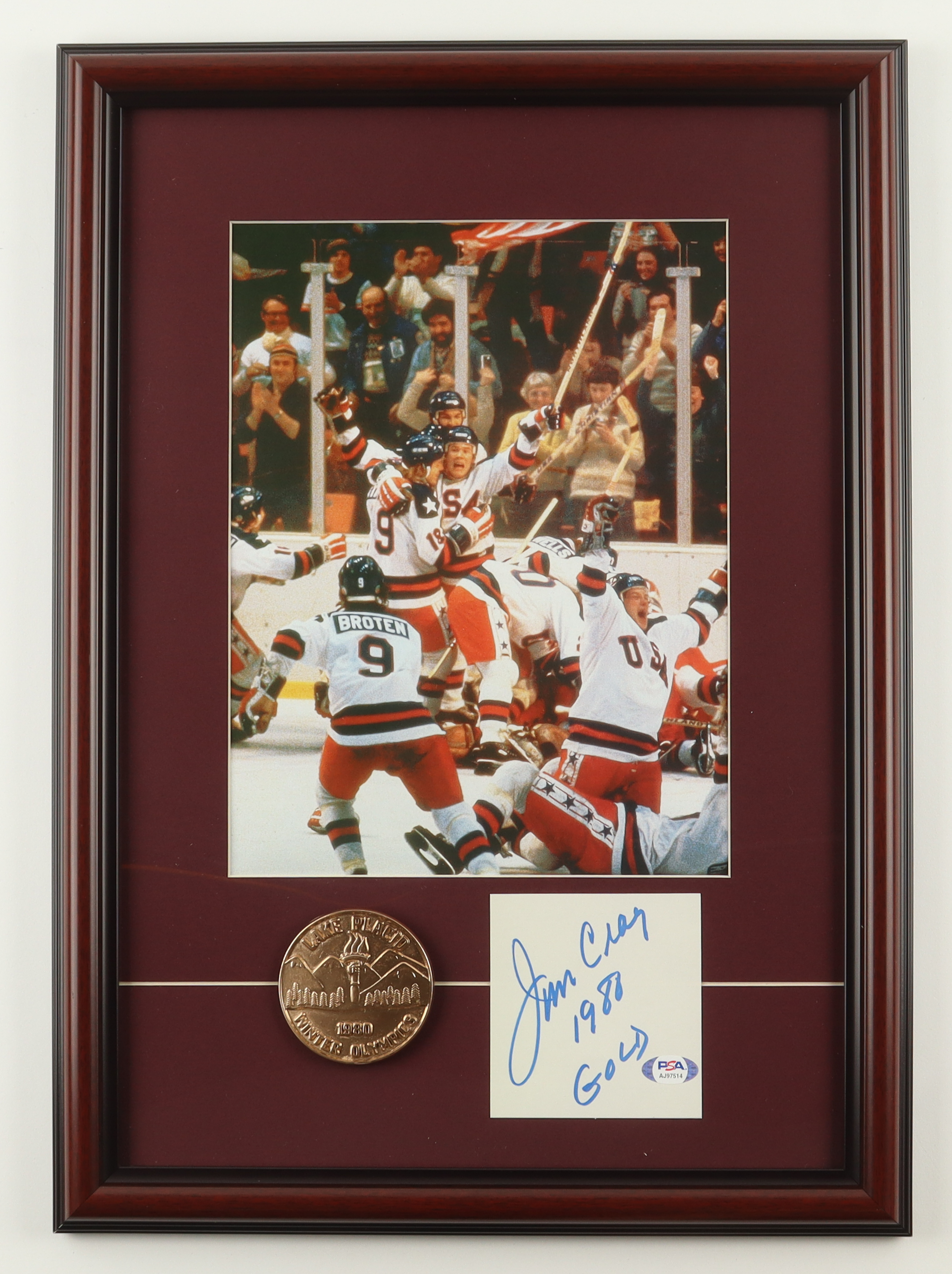 Jim Craig Signed "The Miracle on Ice Team USA" Custom Framed Cut Display with Brass Olympic Emblem Inscribed "1980 Gold" (PSA) at PristineAuction.com Jim Craig Signed "The Miracle on Ice Team USA" Custom Framed Cut Display with Brass Olympic Emblem Inscribed "1980 Gold" (PSA) at PristineAuction.com