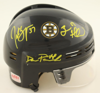 Patrice Bergeron, Brad Marchand & David Pastrnak Signed Bruins Mini Helmet (Perfection Line) at PristineAuction.com