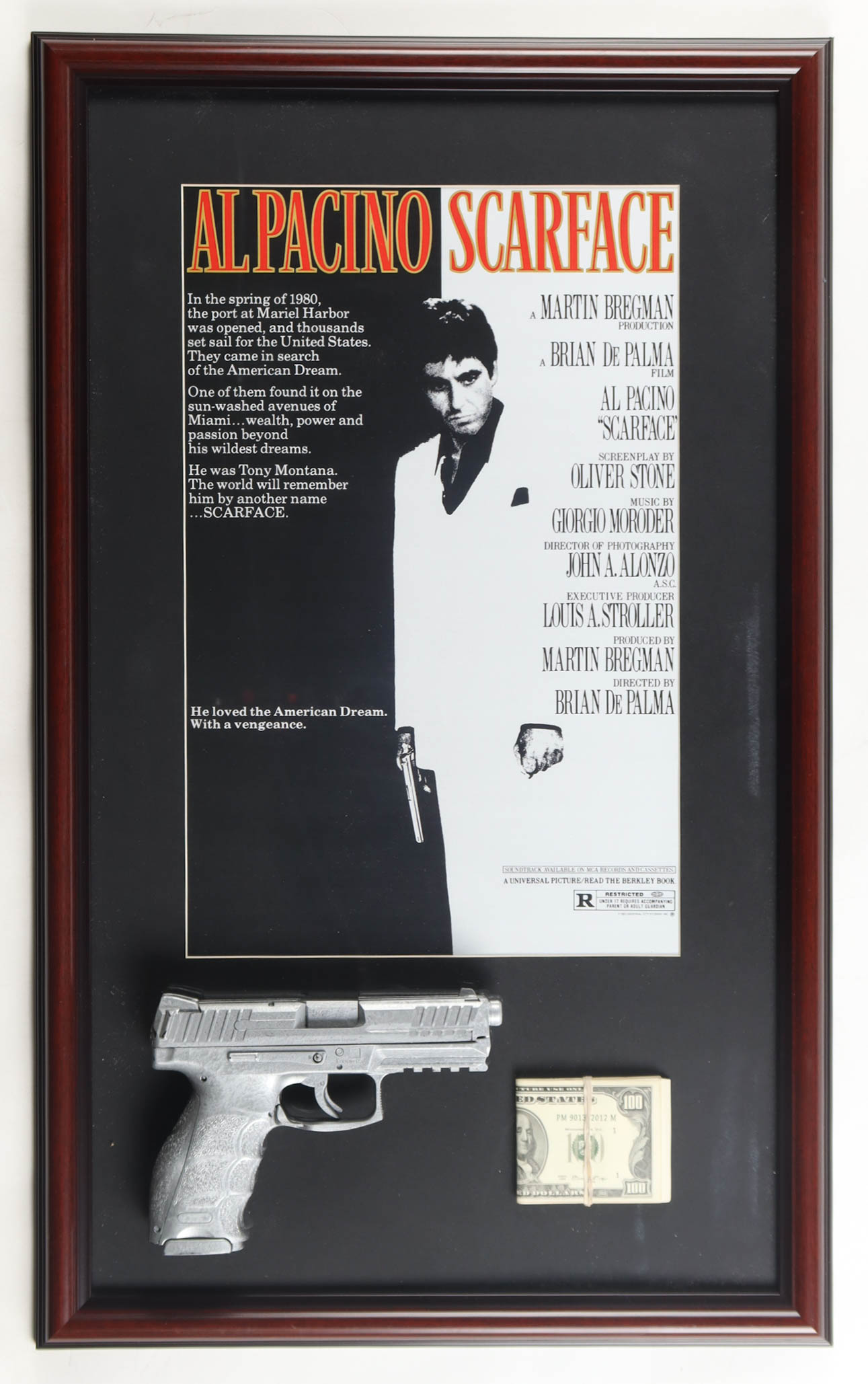 "Scarface" Custom Framed Movie Poster Display with Prop Replica Money Stack & Pistol at PristineAuction.com "Scarface" Custom Framed Movie Poster Display with Prop Replica Money Stack & Pistol at PristineAuction.com