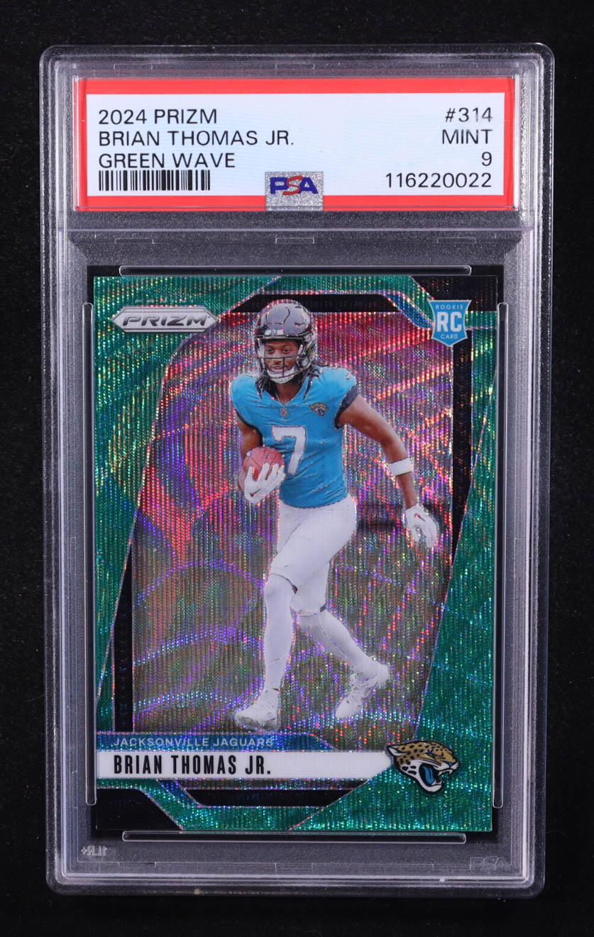 Brian Thomas Jr. 2024 Panini Prizm Prizms Green Wave #314 RC (PSA 9) at PristineAuction.com Brian Thomas Jr. 2024 Panini Prizm Prizms Green Wave #314 RC (PSA 9) at PristineAuction.com