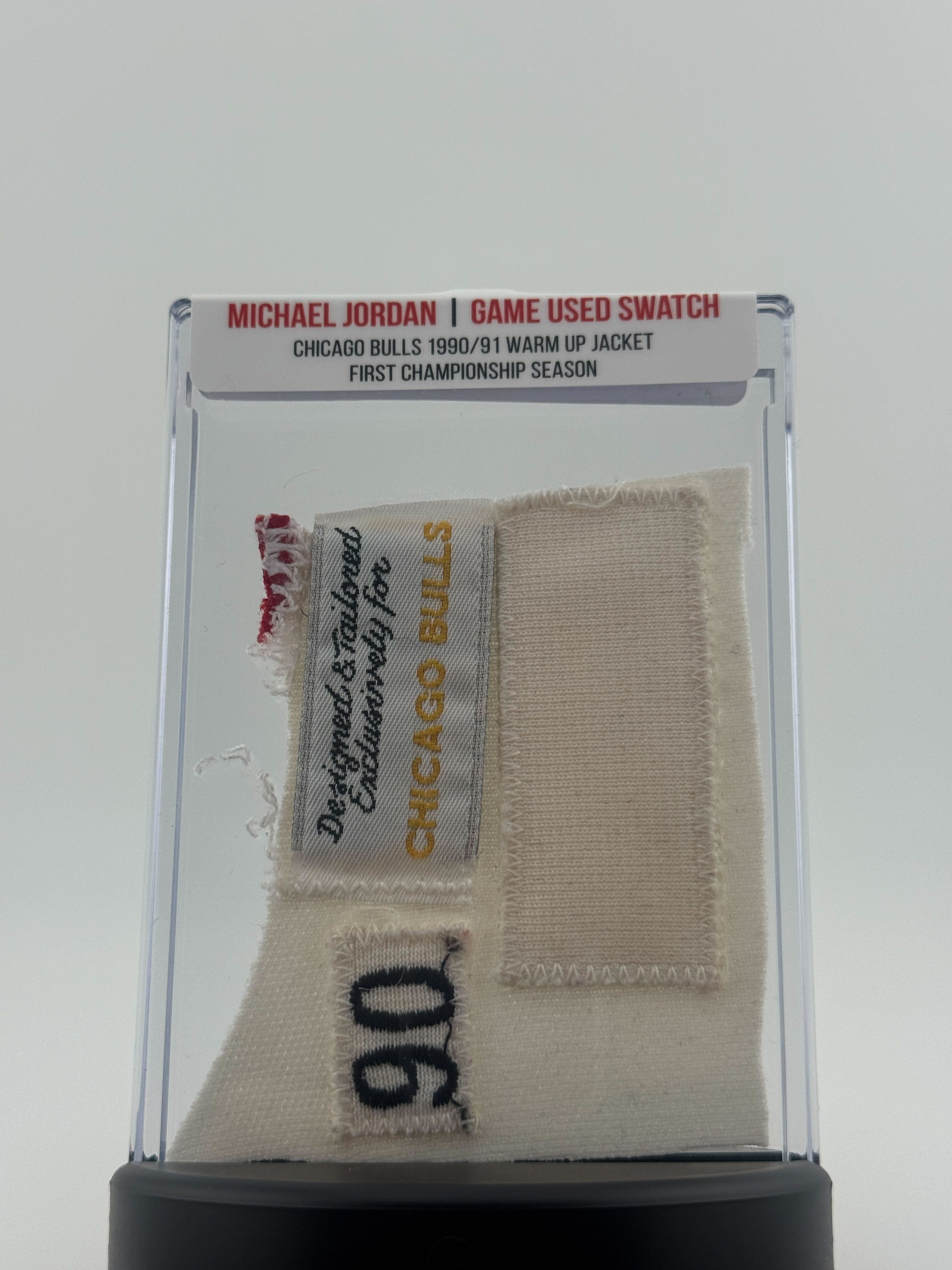 Michael Jordan 1990-91 Chicago Bulls Championship Game Worn Jacket Swatch Mystery Box - Series 1 at PristineAuction.com Michael Jordan 1990-91 Chicago Bulls Championship Game Worn Jacket Swatch Mystery Box - Series 1 at PristineAuction.com