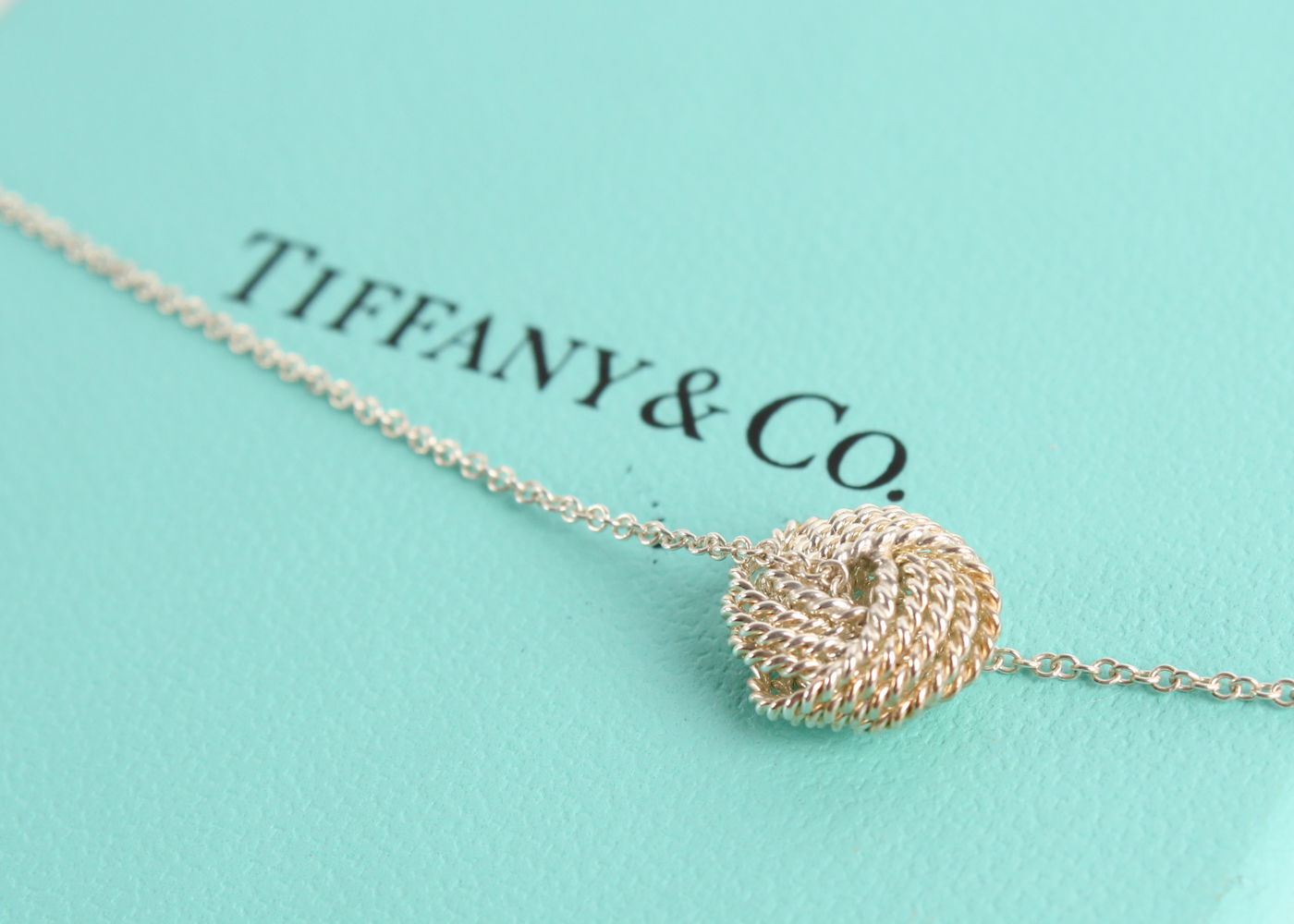 Tiffany & Co. Twist Knot Pendant Necklace at PristineAuction.com Tiffany & Co. Twist Knot Pendant Necklace at PristineAuction.com