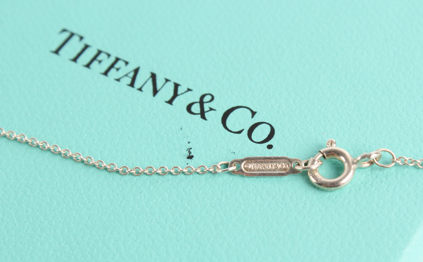 Tiffany & Co. Twist Knot Pendant Necklace at PristineAuction.com Tiffany & Co. Twist Knot Pendant Necklace at PristineAuction.com