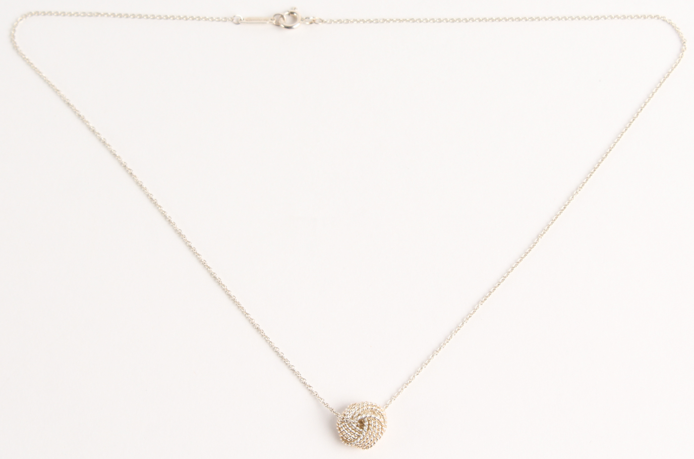 Tiffany & Co. Twist Knot Pendant Necklace at PristineAuction.com Tiffany & Co. Twist Knot Pendant Necklace at PristineAuction.com