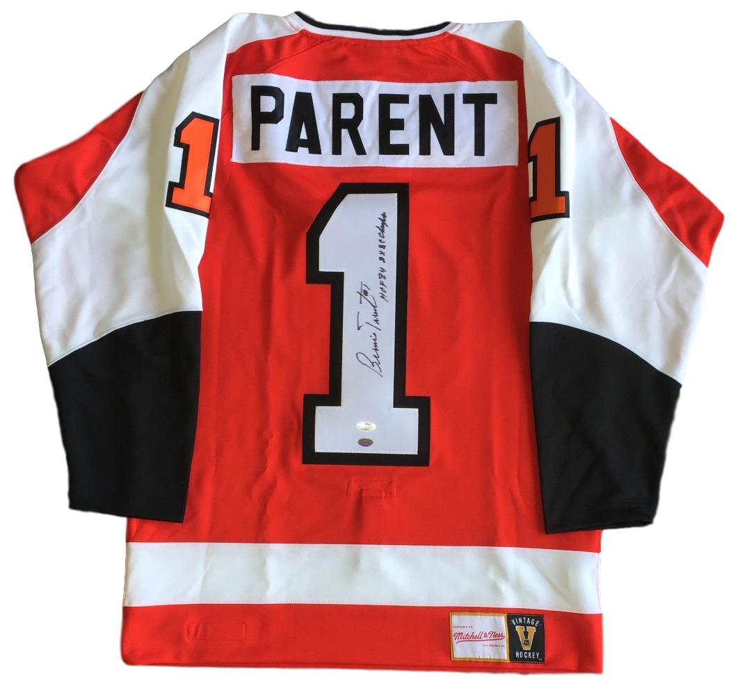 Bernie Parent Signed Flyers Mitchell & Ness Jersey Inscribed "HOF 84" & "2x SC Champs" (JSA COA & SI Hologram) at PristineAuction.com Bernie Parent Signed Flyers Mitchell & Ness Jersey Inscribed "HOF 84" & "2x SC Champs" (JSA COA & SI Hologram) at PristineAuction.com