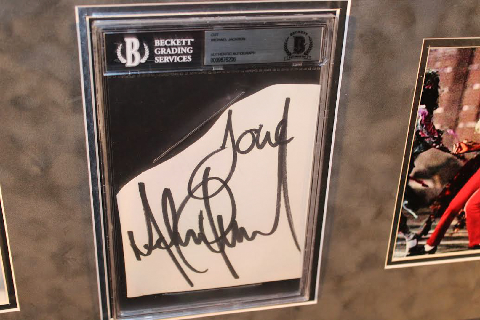 Michael Jackson Signed 27x33 Custom Framed Cut Display Inscribed "Love" (Beckett Encapsulated) at PristineAuction.com Michael Jackson Signed 27x33 Custom Framed Cut Display Inscribed "Love" (Beckett Encapsulated) at PristineAuction.com