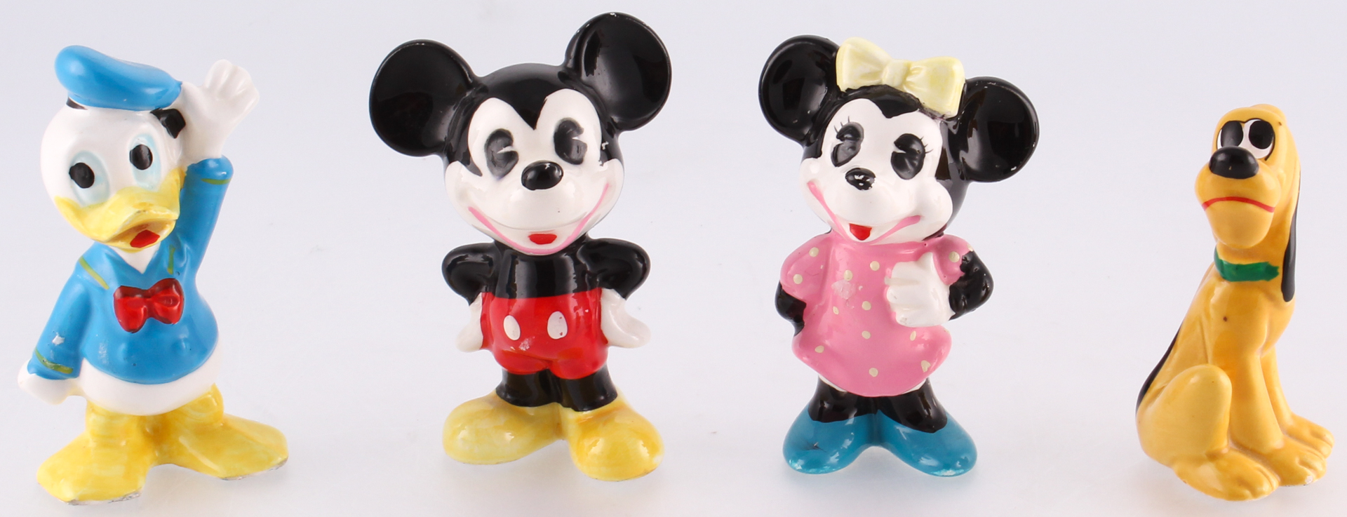 Set of (4) Vintage 1970's Disney Ceramic Figurines at PristineAuction.com Set of (4) Vintage 1970's Disney Ceramic Figurines at PristineAuction.com