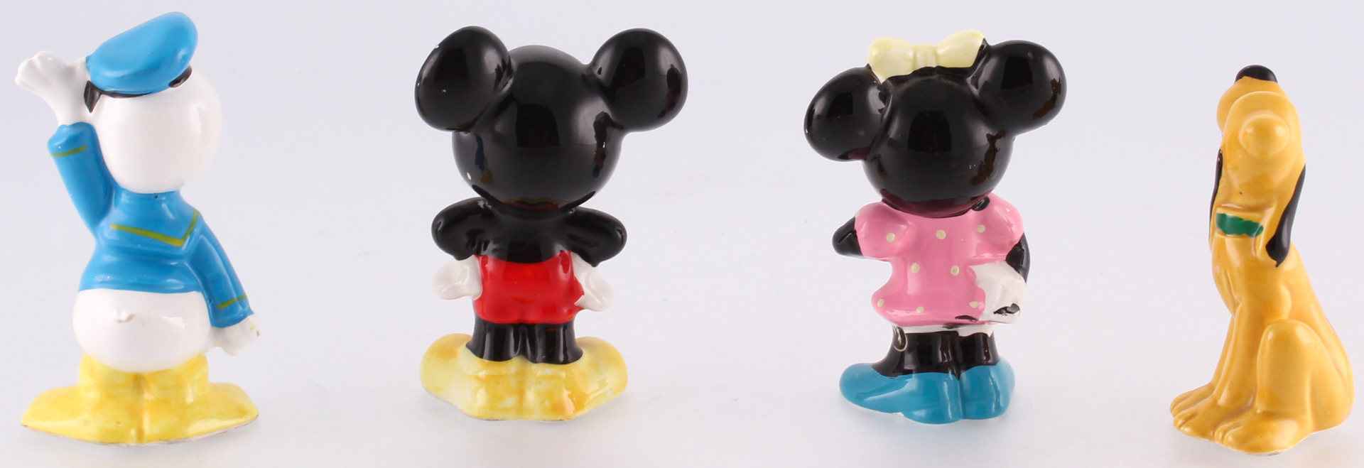 Set of (4) Vintage 1970's Disney Ceramic Figurines at PristineAuction.com Set of (4) Vintage 1970's Disney Ceramic Figurines at PristineAuction.com