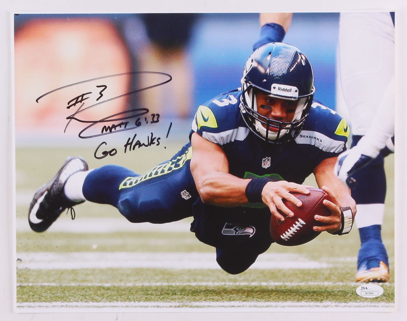 Russell Wilson Signed Seahawks 11x14 Photo Inscribed "Go Hawks!" (JSA COA) at PristineAuction.com Russell Wilson Signed Seahawks 11x14 Photo Inscribed "Go Hawks!" (JSA COA) at PristineAuction.com