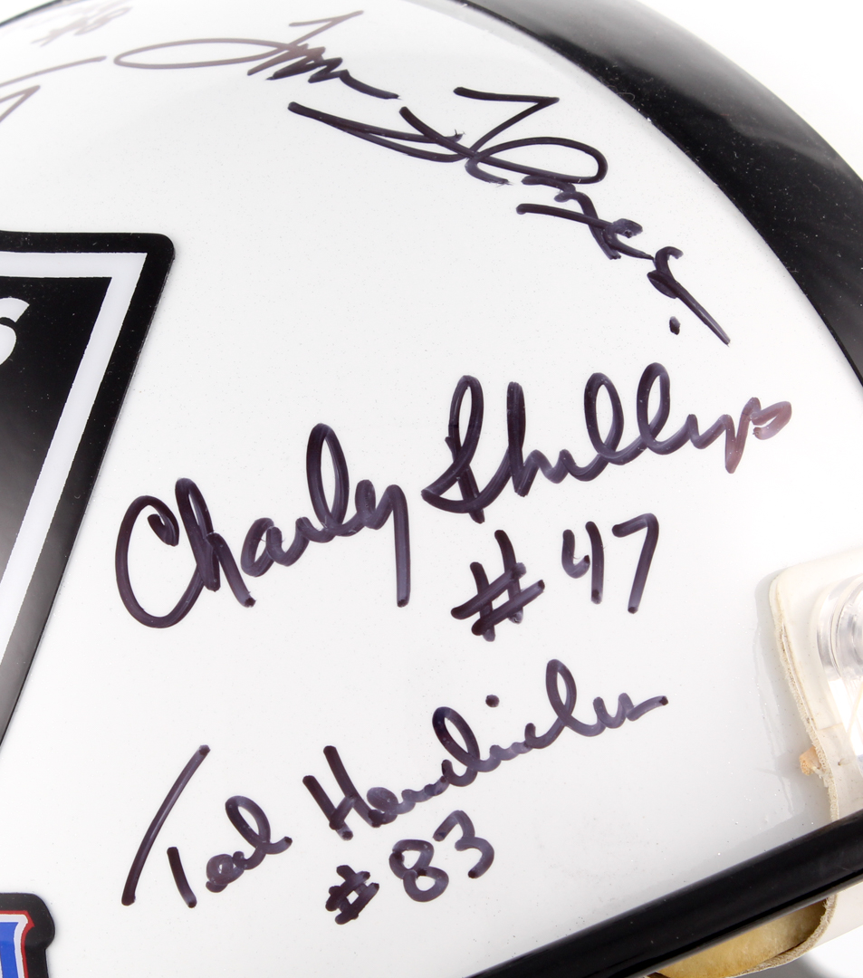 1976 Oakland Raiders Full-Size Authentic Super Bowl Logo Helmet Team-Signed by (11) with Ted Hendricks, Charlie Phillips, Tom Flores, Ray Guy (JSA COA) at PristineAuction.com 1976 Oakland Raiders Full-Size Authentic Super Bowl Logo Helmet Team-Signed by (11) with Ted Hendricks, Charlie Phillips, Tom Flores, Ray Guy (JSA COA) at PristineAuction.com
